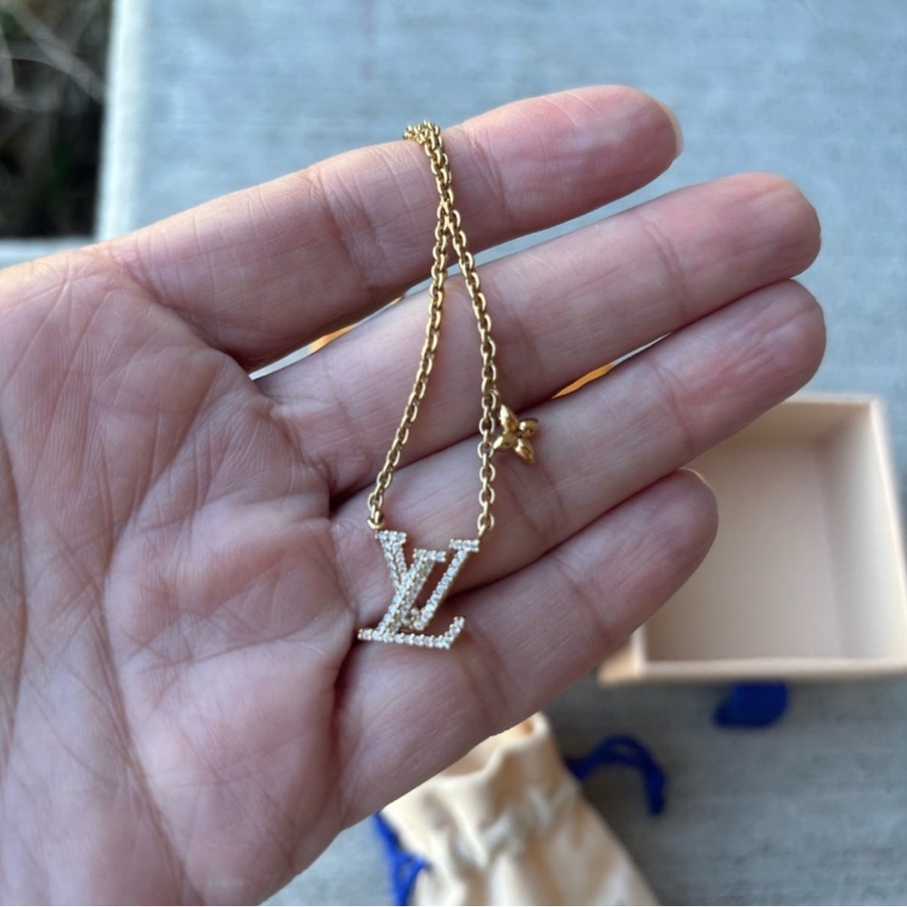 Louis Vuitton Gold Necklace with Interlocking LV Pendant